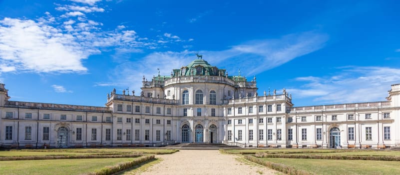 Stupinigi, Italy - 19 August 2022: Stupinigi royal palace exterior, Italy travel destination, blue sky, nobody