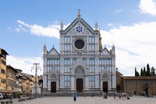Florence, Italy - June 2022: Basilica of Santa Croce, blue sky and clouds