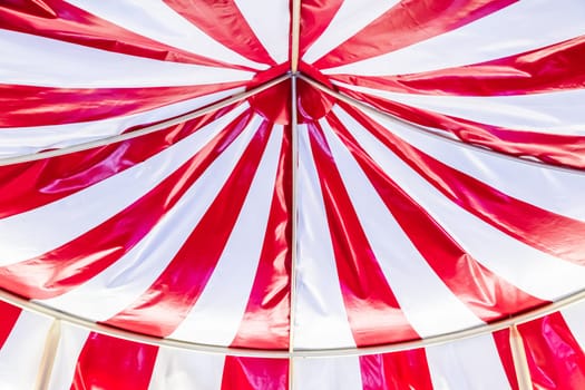 Circus tent background. Colorful design, striped white and red, retro entertainment.