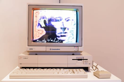 Venaria Reale, Italy - October 2022: Computer Commodore Amiga 1000 with floppy disk, mouse, beige