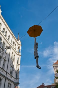 the art installation Slight Uncertainty, Femme Medium by Czech artist Michal Trpak in the old town of Prague