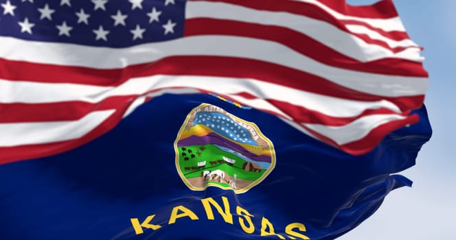 Kansas state flag and the American flag waving in the wind on a clear day. US state flag. Pride and patriotism concept. 3d illustration render. Rippled Fabric. Selective focus