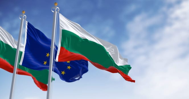 Flags of Bulgaria and the European Union waving in the wind on a clear day. Bulgaria became a member of the EU in January 2007. 3d illustration render. Fluttering textile
