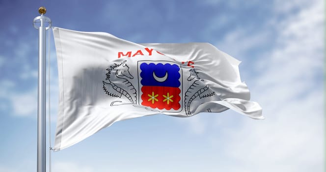 Flag of Mayotte waving in the wind on a clear day. Overseas department and region of France. 3d illustration render. Fluttering fabric.
