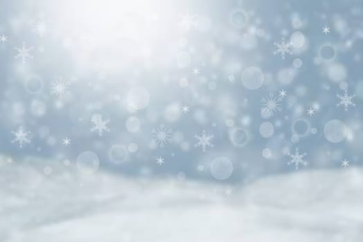 Abstract blurred festive winter christmas or Happy New Year background with shiny blue and white bokeh lighted snow landscape with sky and sun. Space.