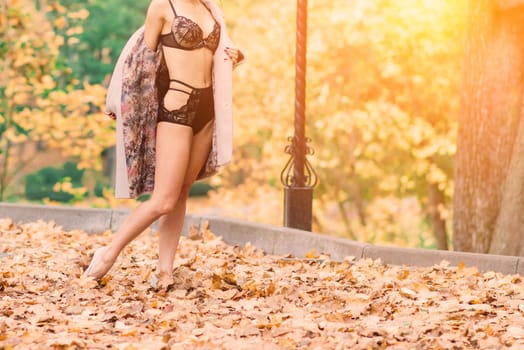 Sexy brunette female in autumn forest, public park. Sport, slender body, underwear