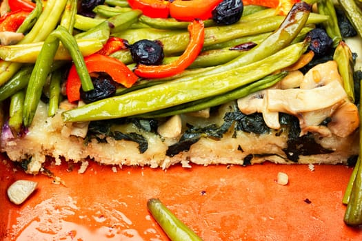 Baked open vegetable pie with green or bush beans and bell peppers.
