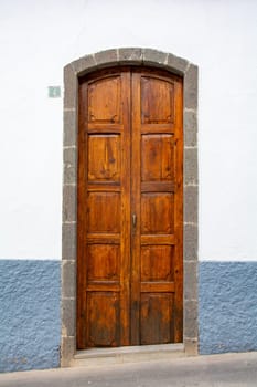 Old wooden door on a house on the Canary Island of Gran Canaria in Spain