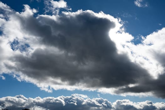 Dark clouds are gathering with blue sky