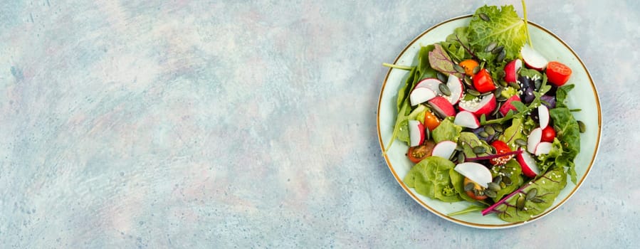 Easy salad with radish, greens, tomato and sesame. Food for vegetarians.