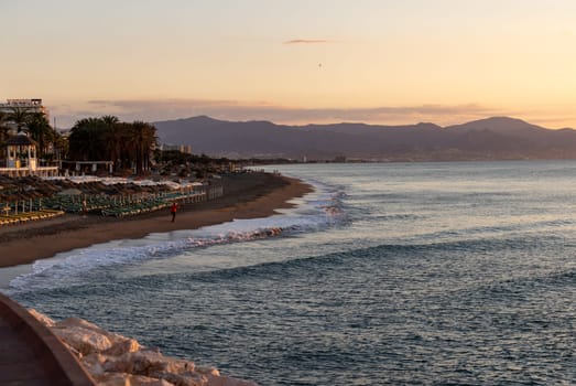 View of Bajondillo Beach in Torremolinos at sunrise. Costa del Sol, Spain.