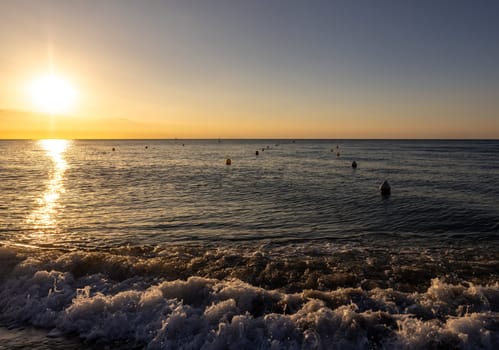 Sunrise over the Mediterranean Sea seen from the beach in Torremolinos. Costa del Sol, Spain