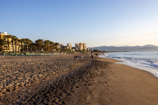Torremolinos, Spain - September 12, 2023: View of Bajondillo Beach and hotels in Torremolinos at sunrise. Costa del Sol, Spain.