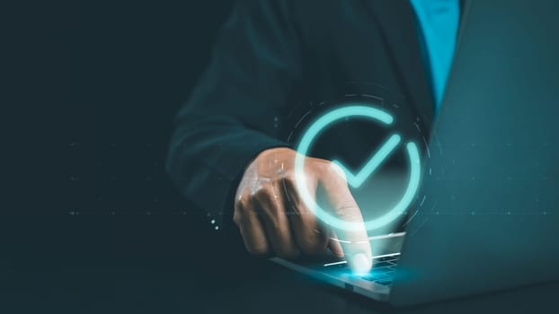Businessman hand touching glowing correct sign mark with copy space area for document approval and project approve concept, mark correct for online approve paperless and quality assurance concept.