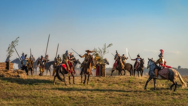 Gniew, Poland, Aug 2020 Polish heavy cavalry, Hussars sword fighting on a battlefield. Historical reenactment of Battle of Gniew, Polish Swedish war