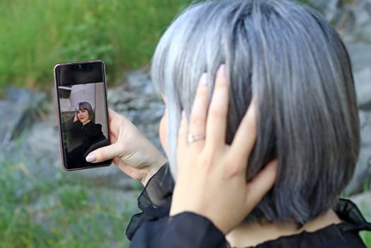 A woman takes a selfie of herself