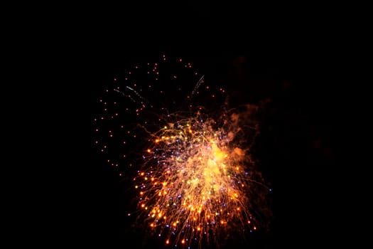 Big colorful fireworks in the black night sky