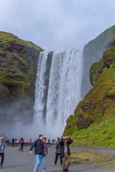 Skogar Iceland - July 28, 2023: Tourists visiting Skogafoss waterfall in south Iceland