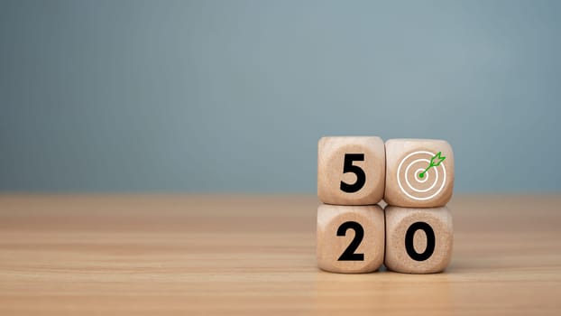 Wooden cubes with net zero icon in 2050 on wooden background, Net zero by 2050, Carbon neutral, Net zero green house gas emissions target, Climate neutral long term strategy, No toxic gases.