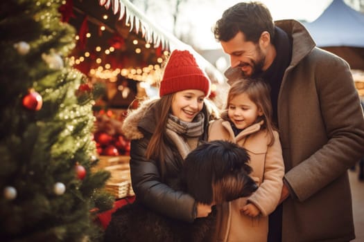 Cheerful full family while shopping outdoors on a Christmas market. The family is enjoying the festive atmosphere, exploring Christmas souvenir shops, and selecting presents for the winter holidays. People are having fun, adorned in warm seasonal outfits