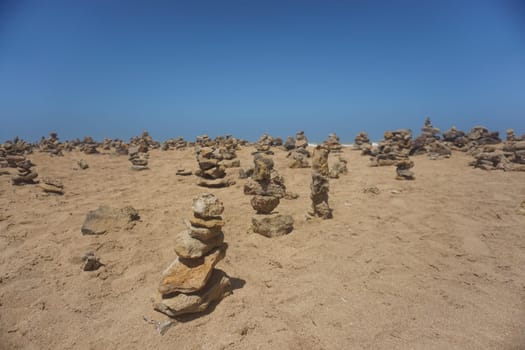 Man made stone piles at Punta Gallinas for good luck, La Guajira, Colombia 2020