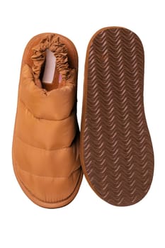 Slippers isolated. Close-up of a pair of female brown warm and soft cosy terry house slippers isolated on white background. Clipping path. Womens shoes. Macro.