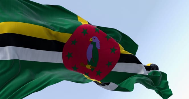 Dominica national flag waving on a clear day. Green field, a cross of yellow, black, and white, a red disk with a purple Sisserou Parrot, and ten green stars. 3d illustration render.