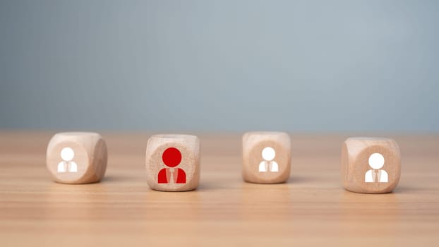 Wooden block printed icon of CRM concept representing business goal selection, target customers, marketing plan and strategy, customer centric strategy.