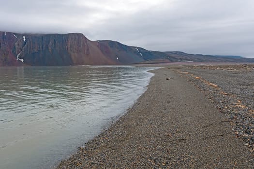 Quiet Gravel Beach on the High Arctic on Lomfjorden in the Svalbard Islands