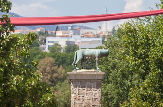 Merida, Spain - June 4th, 2023: Emerita Ludica Festival decoration 2023, Merida, Spain. She-wolf bronze sculpture at bottom