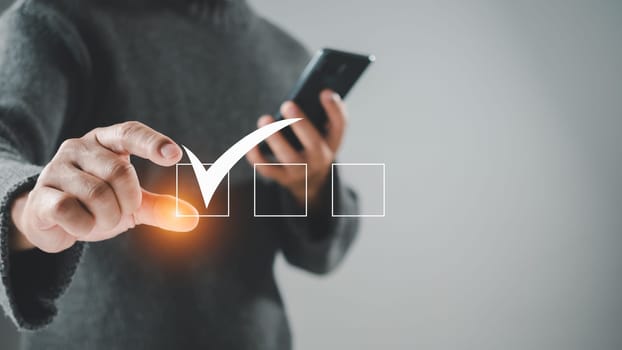 Man holding correct white symbol in white frame. For business proposals and concept approval documents