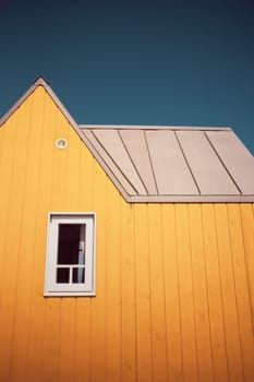 Little yellow tiny house, close to the coast. Photography taken in France