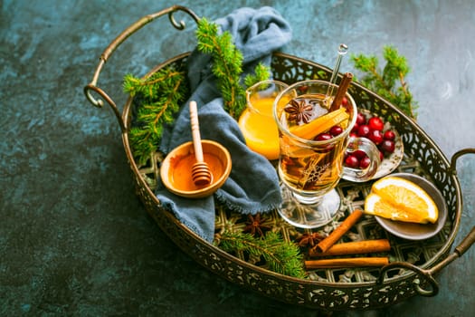 Delicious white mulled wine with orange, honey, cranberries and spices