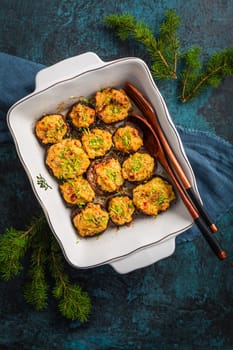 Oven baked stuffed mushrooms - champignons with cream cheese and dried tomatoes in casserole