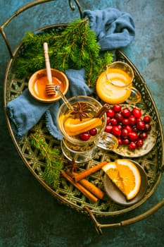 Delicious white mulled wine with orange, honey, cranberries and spices