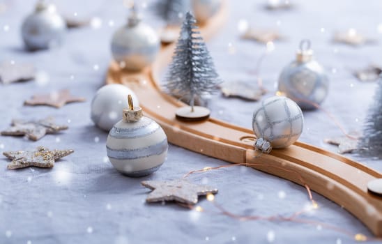 Festive table decoration with wooden railway for winter and Christmas, dining table  with ornaments