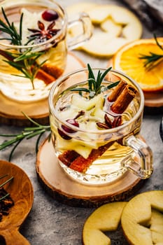 Delicious white mulled wine with apples, cranberries and spices
