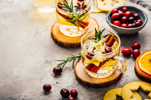 Delicious white mulled wine with apples, cranberries and spices