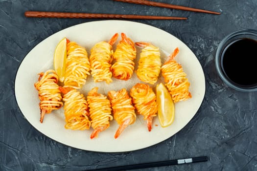 Fried rolled potato shrimps, prawns and potato rolls. Popular Asian food. Vietnamese cuisine. Flat lay.