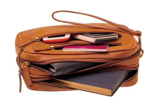 Leather handbag isolated. Close-up of brown businessman luxury leather wrist handbag. Fashionable brown leather briefcase or bag for men. Macro.