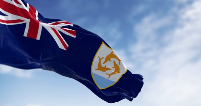 Anguilla Flag waving in the wind on a clear day. Blue Ensign with British flag in canton, coat of arms, three dolphins on white shield. 3d illustration render. Selective focus. Fluttering fabric