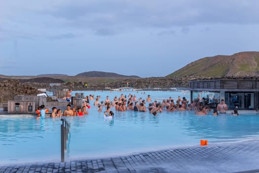 Reykjavik, Iceland - July 26, 2023:The Blue Lagoon geothermal spa is one of the most visited attractions in Iceland. People relax in the blue lagoon.