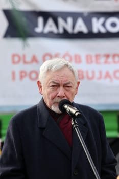 Cracow, Poland - Dec 17, 2023: President of Krakow Jacek Majchrowski participates in the Christmas Eve for the poor and homeless on the Main Square in Cracow.