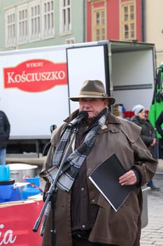 Cracow, Poland - Dec 17, 2023: Jan Kosciuszko a philanthropist, restaurateur and organizer Christmas Eve for poor and homeless on the Main Square in Cracow. Poland
