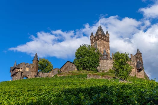 Cochem, Germany, August 10, 2023. Beautiful view of the hilltop castle (Reichsburg Cochem) in the touristic town of Cochem on the Moselle River in Rhineland-Palatinate in Germany.