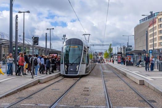 Luxembourg city, August 01, 2023. Tram stop in a street in the city center full of people