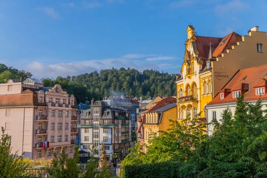 Karlovy Vary, Czech Republic: August 7, 2023. View colorful riverfront houses in Czech famous spa city. Romantic architecture of Bohemia. Urban scene