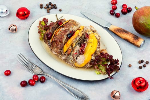 Delicious pork roll baked with aromatic mango pieces. Roast pork meat roll.