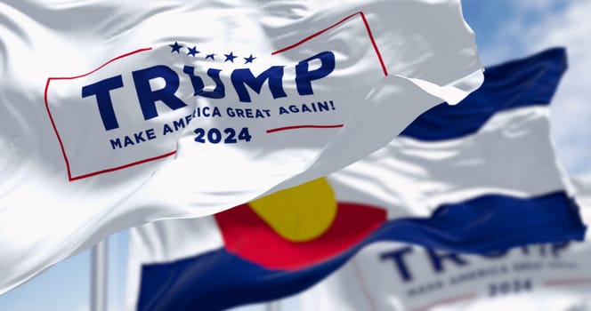 Denver, US, Dec.20 2023: Trump 2024 campaign flag waving with Colorado State flag. On Dec. 2023 Colorado Supreme Court Rules Trump Ineligible for Presidency. Illustrative editorial illustration