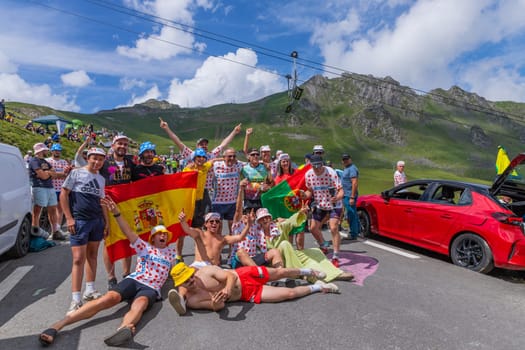 Col du Tourmalet, France - July 06 2023: Cycling fans waiting for the buch at the top of the Col du Tourmalet in Pyerenees mountains during the stage 6 of Le Tour de France 2023